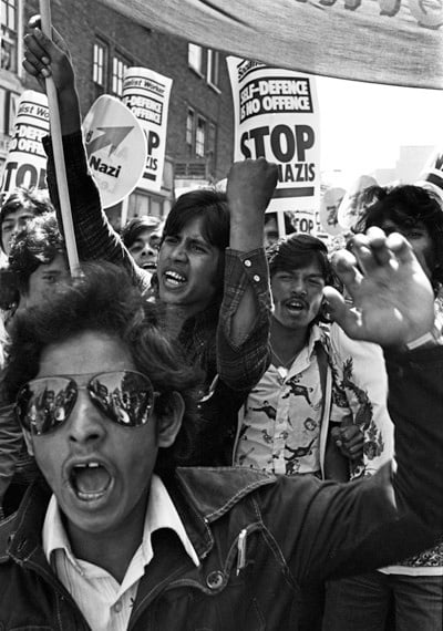Bengali youths lead a demonstration. Brick Lane, London 1978