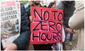 Pink placard that writes "NO TO ZERO HOURS".