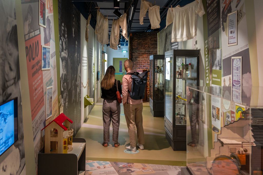 Image of two people looking at one of the museum's exhibitions.