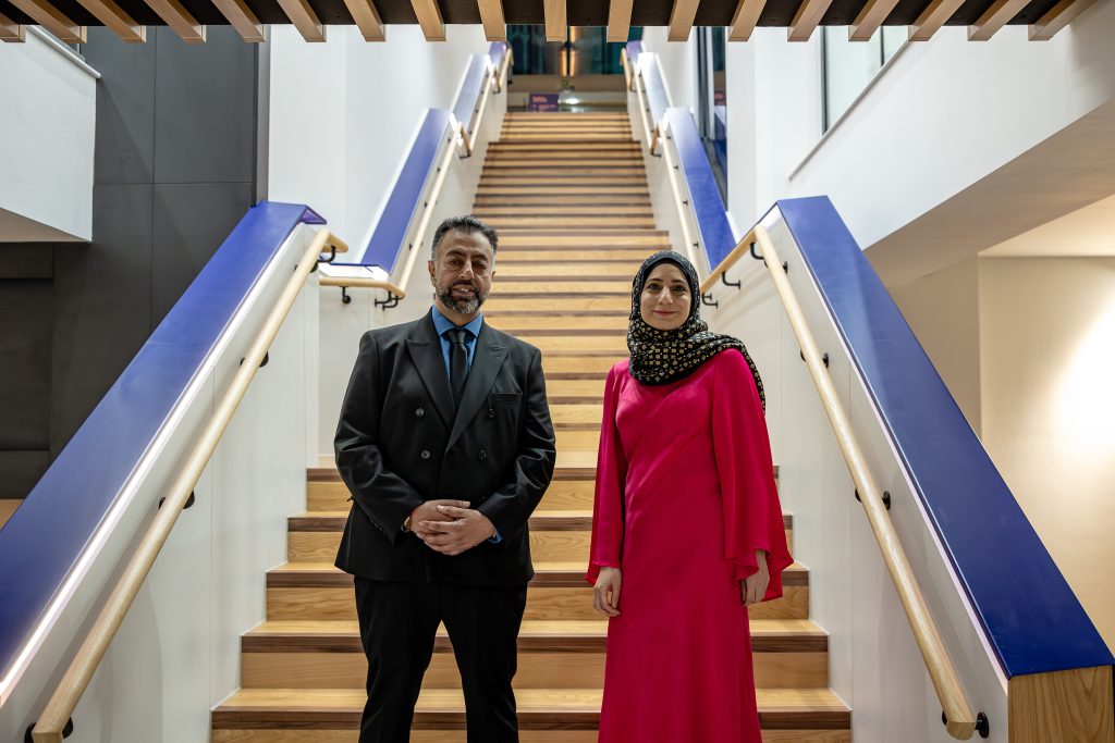 Image of two trustee members standing on the new stairs.