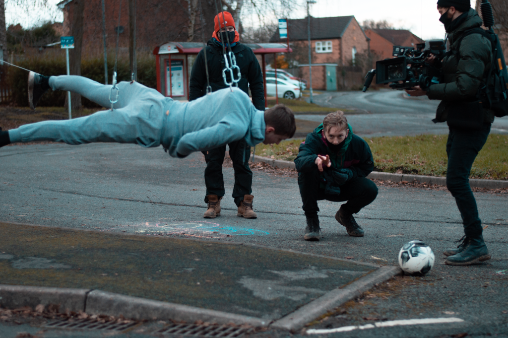 Image of an Oulton resident suspended while Alfie gives directions.