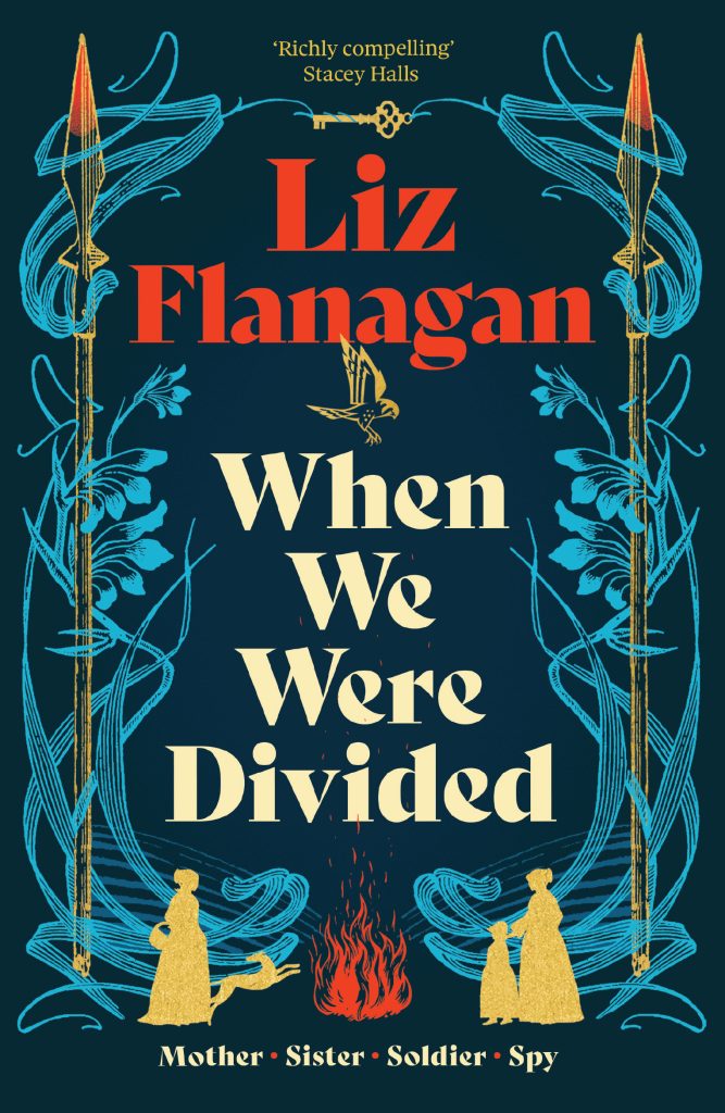 Book cover of When We Were Divided by Liz Flanagan, featuring illustrated blue foliage and gold figures around the title, with symbols of war, fire and family, and the tagline “Mother · Sister · Soldier · Spy.