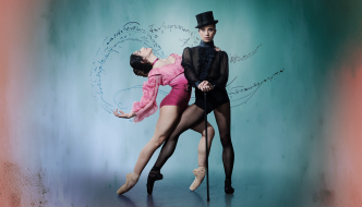 Two dancers pose dramatically against a soft blue-green background: one in a pink costume arches backward en pointe, supported by a second dancer dressed in black with a top hat and cane, while swirling handwritten marks curve behind them like motion lines.