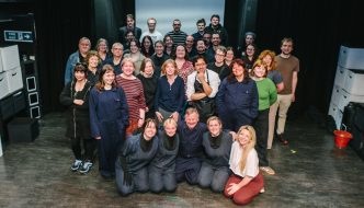 Leeds Arts Centre’s 1984 cast and crew pictured on stage at the Carriageworks Theatre.